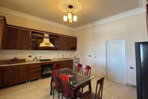 a kitchen with a table and chairs and a stove at Sirik guest house in Geghanist +18 photos