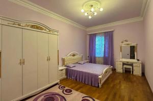 a bedroom with a bed and a dresser and a mirror at Sirik guest house in Geghanist
