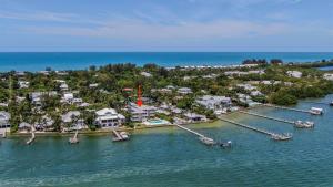 an aerial view of a resort with boats in the water at Captiva Hide A Way 1B in Captiva
