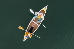 an overhead view of a person on a kayak in the water at Camp Canoe in Franschhoek