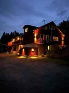 a house lit up at night with lights at Halek Hem - Haga Nest in Haga