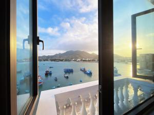 a view of a harbor from a window at Mimosa 8 Hotel - Ninh Chử in Ninh Hải +33 photos