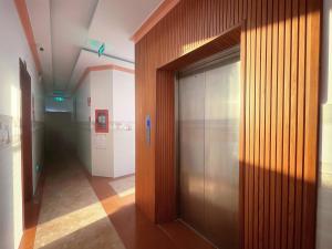 a hallway with a elevator in a building at Mimosa 8 Hotel - Ninh Chử in Ninh Hải