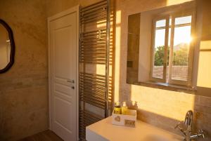 a bathroom with a sink and a mirror at Il Collina - Poets'Vista in La Spezia