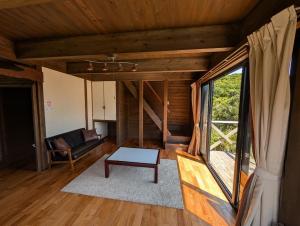 a living room with a couch and a table at koco in Nishinoomote