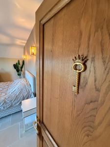 a door with a crown on it in a bedroom at Château D - Roncheval in Mouscron