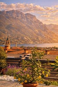 a view of a town with mountains in the background at appartamento SUNLIGHT in Riva del Garda
