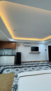 a room with a large white room with a kitchen at Han House's Apartment in Danang