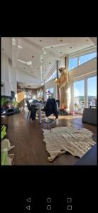 a living room with a stuffed bear standing in a room at Zimmer zum übernachten wg in Münsingen