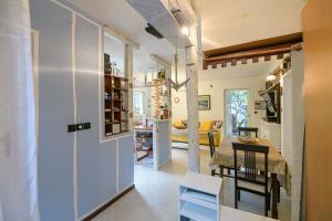 a kitchen and dining room with a table and chairs at Nostromo in Kotor