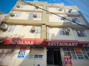 a hotel halal restaurant in front of a building at Hotel Haji Ali - Sahil inn in Ajmer