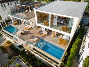 an aerial view of a house with a swimming pool at Villa Gaia in Ko Phangan