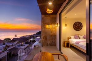 a bedroom with a view of the ocean at Villa Gaia in Ko Phangan