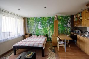 a bedroom with a bed in front of a large window at Apartmán Brezy in Martinske Hole