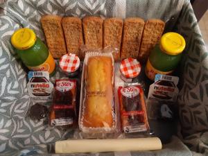 a bag of food with condiments and snacks in it at TROGLODYTE - La Grotte d'Auré in Le Puy-Notre-Dame