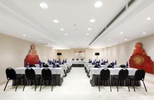 a banquet hall with tables and chairs in a room at Eurostars Palacio de Santa Marta in Trujillo +34 photos