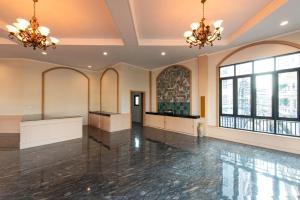a ballroom with two chandeliers and a dance floor at Peya Rama-7 Hotel in Bang O +75 photos