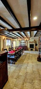 a large dining room with a table and chairs at Villa Ruzin Dvor in Donji Vinjani