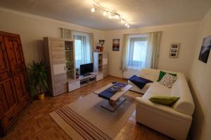 a living room with a couch and a table at Haus Hubertus in Radnig