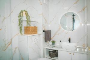 a bathroom with a sink and a mirror at Apartment Matko in Ploče