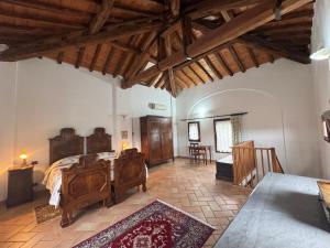 a bedroom with a bed and a table in a room at Agriturismo Aggazzotti in Colombaro +120 photos