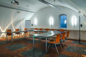 a large room with tables and chairs in it at Hotel Artus - Old Town in Gdańsk