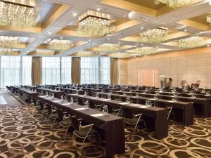 a large room with rows of tables and chairs at Hyatt Regency Mainz in Mainz