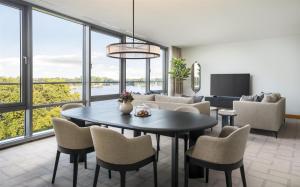 a living room with a table and chairs at Hyatt Regency Mainz in Mainz