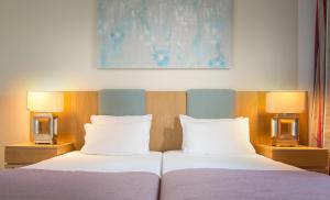 Postel nebo postele na pokoji v ubytování Alkion Hotel
