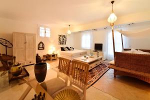 a living room with a couch and a table at Casa di Spetses in Spetses