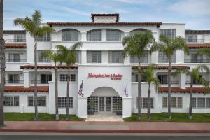 a white building with palm trees in front of it at Hampton Inn & Suites San Clemente - Fully Renovated in San Clemente