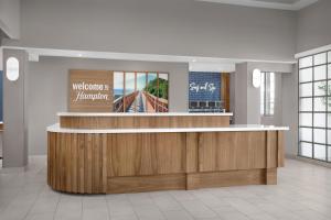 a lobby with a reception desk in a building at Hampton Inn & Suites San Clemente - Fully Renovated in San Clemente +79 photos