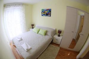 Ein Bett oder Betten in einem Zimmer der Unterkunft Apartment Zubčić