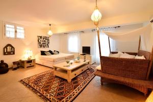 a living room with a couch and a table at Casa di Spetses in Spetses