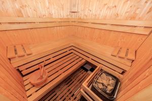 an overhead view of a sauna with two chairs and a tub at Hotel Artus - Old Town in Gdańsk