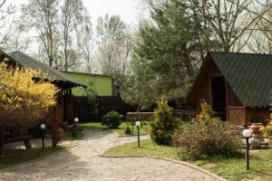 a garden with a path leading to a house at DREAM HOTEL Sambir in Sambir