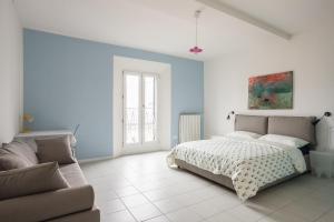 Posteľ alebo postele v izbe v ubytovaní Saragozza Apartments