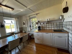 a kitchen with a table and a dining room at K Zastavce 557 in Kovářská