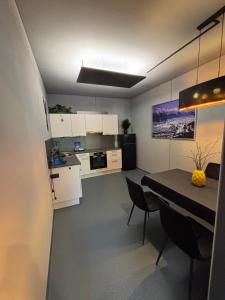 a kitchen and dining room with a table and chairs at Appartement Weiskopf in Reith bei Seefeld