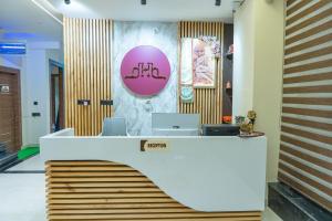 an office with a desk with a laptop on it at Hotel Hrishikesh High Tapovan in Rishīkesh