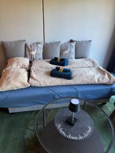 a blue couch with pillows on it in a living room at Appartement Weiskopf in Reith bei Seefeld +28 photos