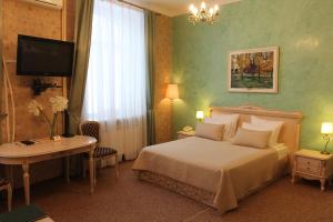 Posteľ alebo postele v izbe v ubytovaní U Kremlya