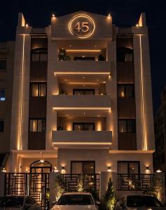 a large white building with a clock on it at Regal view Aparthotel in Cairo