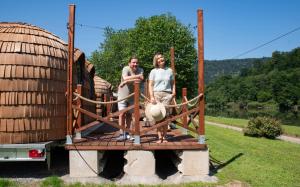 a man and a woman standing on a wooden bridge at Camping Neckargemünd bei Heidelberg in Neckargemünd +34 photos