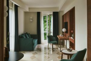 a living room with a blue couch and a table at Belvedere Bellagio in Bellagio +143 photos