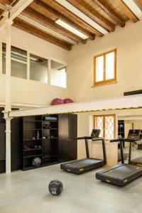 a gym with two exercise bikes in a room at Combo Venezia in Venice