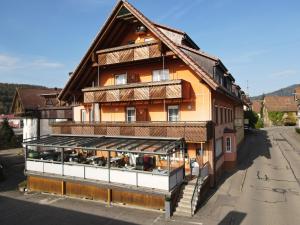 a large building with a store in front of it at Steakhüsli Hotel- Restaurant in Schopfheim