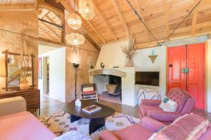 a living room with a couch and a table at Eclectic Monte Laginha Alentejo in Aldeia do Cano