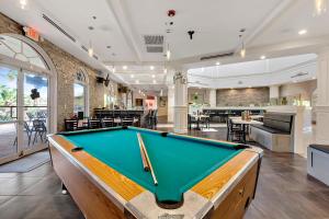 a pool table in the middle of a room at 25% Off 3BR Disney Area Villa in Davenport