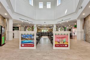 a store with three signs in a building at 25% Off 3BR Disney Area Villa in Davenport +29 photos